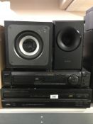 A Denon five disc cd changer together with goodmans cd player and two speakers