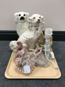 A tray containing three Staffordshire dogs, one with glass eyes,