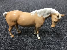 A Beswick figure - Model 1812 Mare (facing right, head down), palomino,