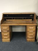 An antique oak twin pedestal desk,