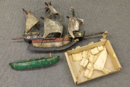 A malachite boat with bone fittings and another boat model