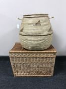 A wicker laundry basket together with a picnic hamper