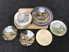 A tray of collector's plates, religious wall plaques,