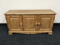 A pine triple door low sideboard