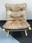 A beech framed leather upholstered relaxer chair