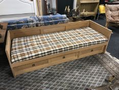 A late 20th century day bed fitted with three drawers
