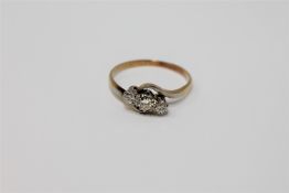 An 18ct gold three stone diamond ring,