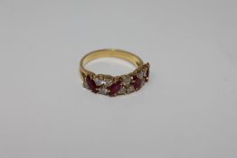An 18ct gold ruby and diamond ring