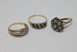 A 9ct gold half-eternity ring together with two diamond and sapphire cluster rings, 9.