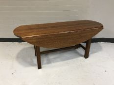 A mahogany drop leaf coffee table