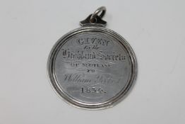 An early nineteenth century ploughing medal given by the Highland Society of Scotland to William