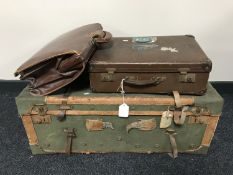 A vintage luggage case with leather trim together with a mid twentieth century suitcase and leather