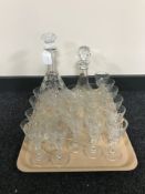 A tray of lead crystal decanters and drinking glasses