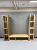 An Ikea beech effect entertainment stand together with two sets of narrow bookshelves