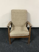 A mid 20th century teak armchair