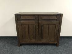 A contemporary oak effect sideboard fitted two drawers