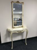 A cream and gilt hall table on cabriole legs and a mirror
