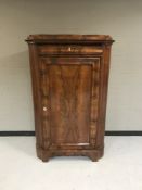 A 19th century mahogany corner cupboard