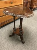 A nineteenth century mahogany pedestal clover leaf table