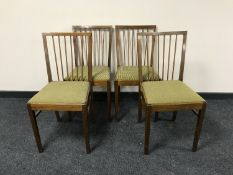 A set of four walnut rail back dining chairs