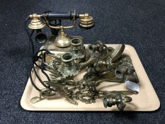 A tray of brass candlesticks in the form of Griffons, brass two-way wall scones,