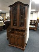 A Victorian style bureau bookcase with arched top
