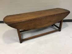A mahogany drop leaf coffee table