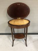 An antique mahogany work table