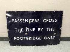 An enamel railway sign - Passengers Cross by the line by the footbridge only CONDITION