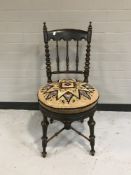 An antique tapestry seated chair