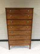 A 20th century mahogany seven drawer chest