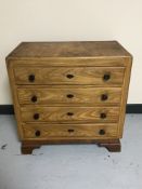 A twentieth century four drawer pine chest