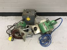A transformer together with a Hitachi router and belt sander