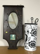An Edwardian oak wall mirror together with a pottery stick stand