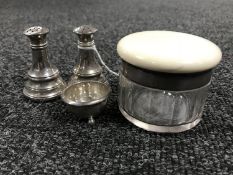 A silver salt and pepper pot together with a silver salt with no line,