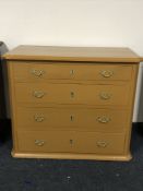 An early twentieth century painted pine four drawer chest