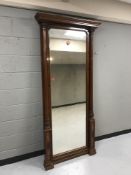 A late nineteenth century mahogany mirror with pillared sides,