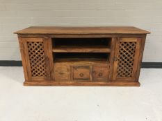 A mango wood entertainment stand