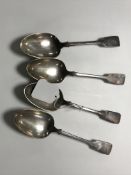 A set of four silver serving spoons