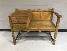 A blond oak telephone table