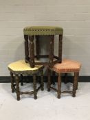 A pair of hexagonal upholstered footstools