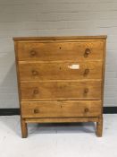 A 20th century oak four drawer chest