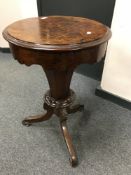 A Victorian walnut pedestal sewing table