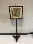 A Victorian rosewood pole screen