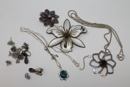 A collection of silver jewellery including a Norwegian enamel flower brooch