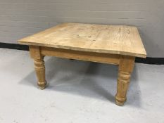 A square pine coffee table