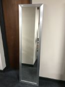 A metal framed hall mirror