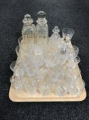 A tray of crystal glasses and decanters
