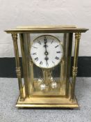 A brass cased German anniversary clock
