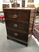A George III mahogany three drawer chest,